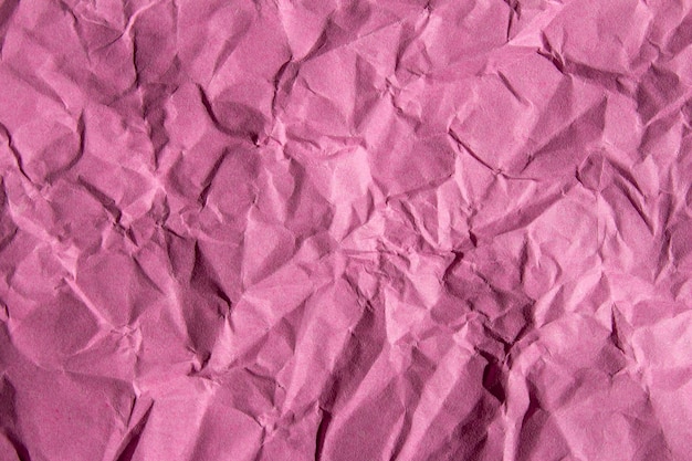 Verfrommeld roze papier textuur achtergrond