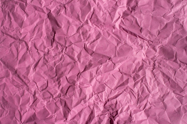 Verfrommeld roze papier textuur achtergrond