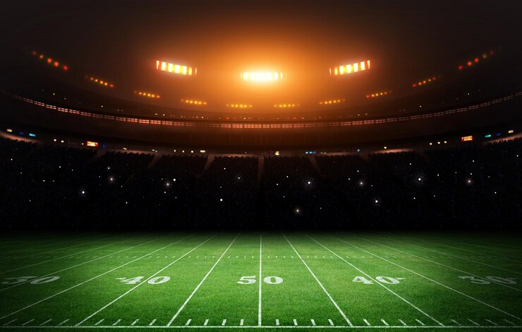 Foto verlicht amerikaans voetbalstadion onder de donkere hemel 3d rendering