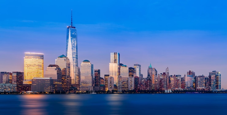 Foto verlichte gebouwen in lower manhattan bij de hudson river