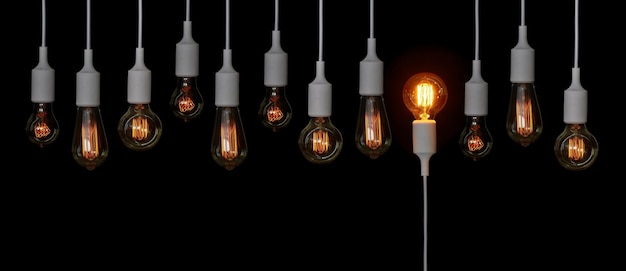 Verlichte gloeilamp op een zwarte achtergrond