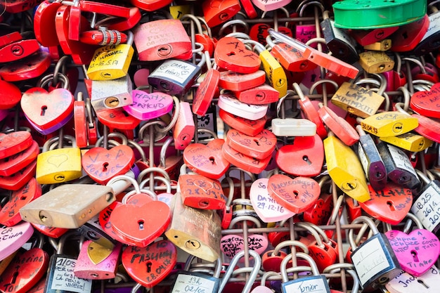 Verona Italy June 2022 background of heartshaped locks on a wall symbol of love forever