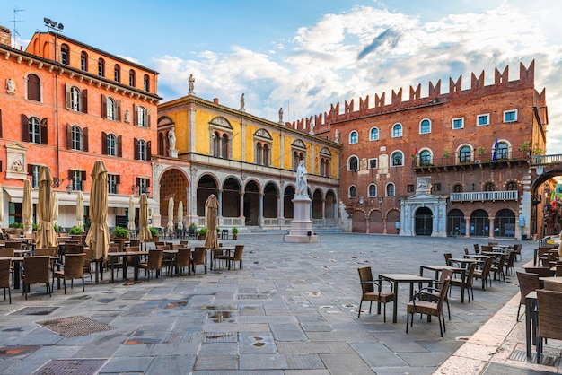 Verona old town square Piazza dei Signori with Dante statue and street cafe with nobody. Veneto, Italy. Tourist destination