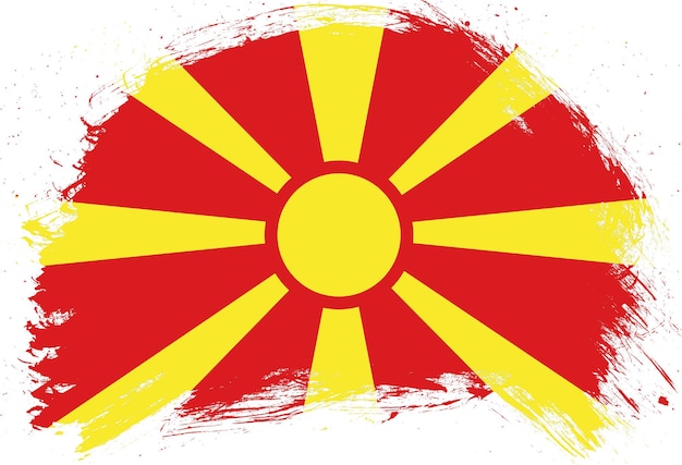 Verontruste penseelstreek geschilderde vlag van Noord-Macedonië op witte achtergrond