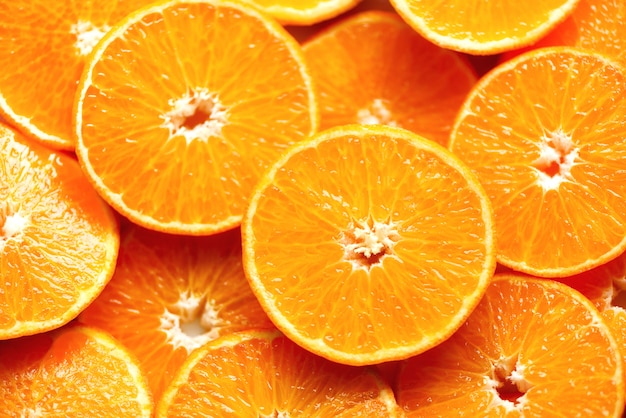 Vers gesneden oranje fruittextuur. Macro, bovenaanzicht, kopie ruimte. Voedsel. Sappige sinaasappelen