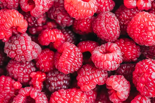 Verse rijpe frambozen, close-up. Bessen kleurrijke achtergrond