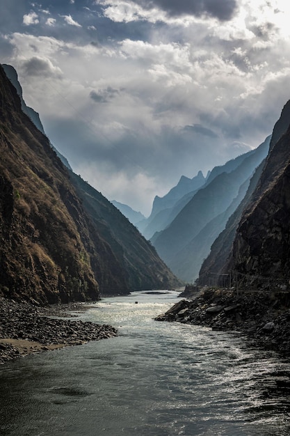 Photo vertical of both sides of the yalong river in jiulong county, sichuan province, china.