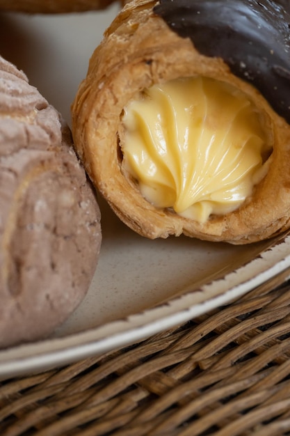 Vertical close-up of homemade mexican bread with cream