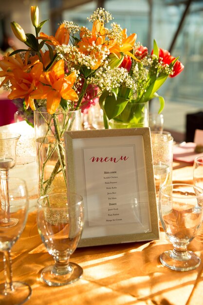 Vertical closeup of the flower decorations on the table