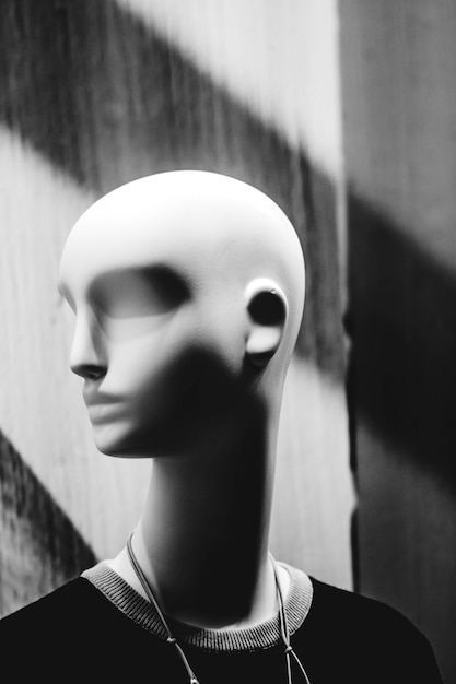 Vertical closeup shot of the female mannequin in grayscale