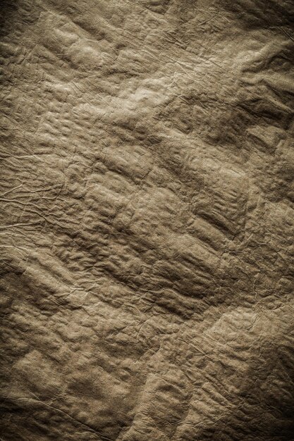 Vertical general view crumpled vintage brown paper texture close up