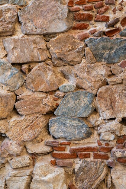 Vertical Image Of An Old Stone Cement And Brick Wall Background And Texture