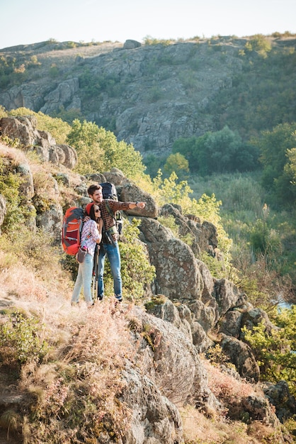 Vertical image of traveling couple near the canyon