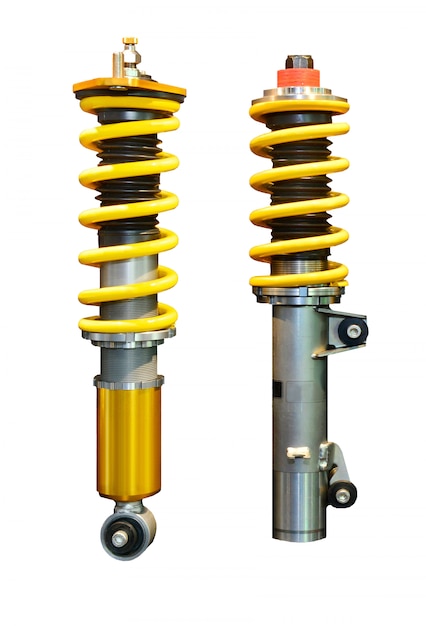 Vertical image of two yellow shock absorber isolated on white space