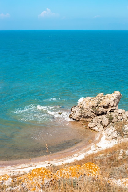 Vertical landscape Sea coast with rocky shore and sandy beach View from the top of the mountain Sea of Azov in Crimea