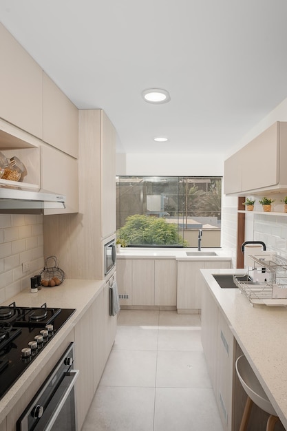 Vertical photo of the corridor of a new kitchen