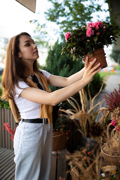 Vertical photo of european beautiful attractive positive happy brunette woman wearing stylish white