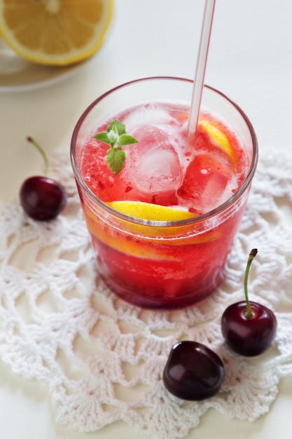 Vertical photo of homemade cherry lemonade in glasses