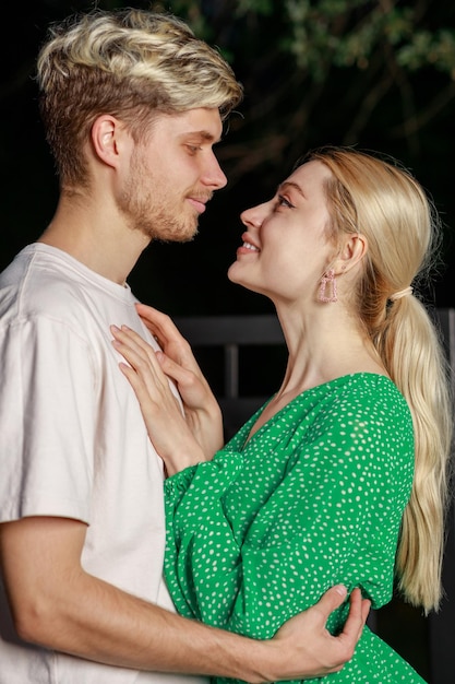 Vertical photo of young couple looking at each other