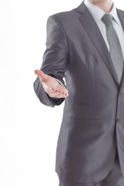 Photo vertical photobusinessman holds out his hand for a handshake