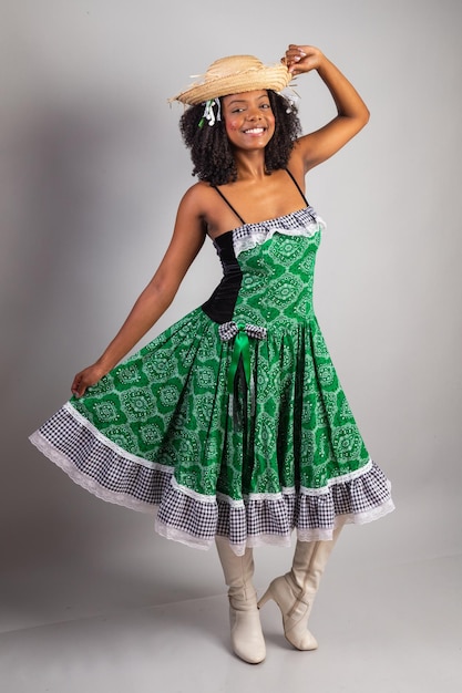 Vertical portrait black Brazilian woman in festa junina clothes Saint John's festival