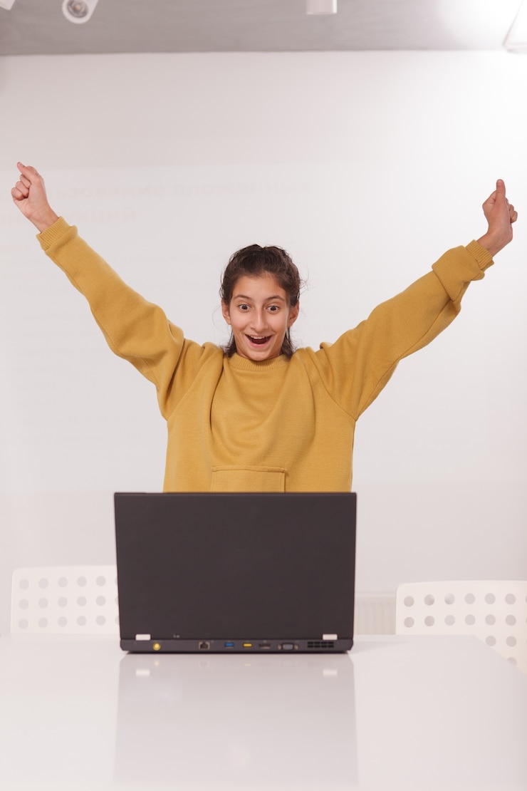 फोटो vertical portrait of a happy teen girl screaming joyfully
