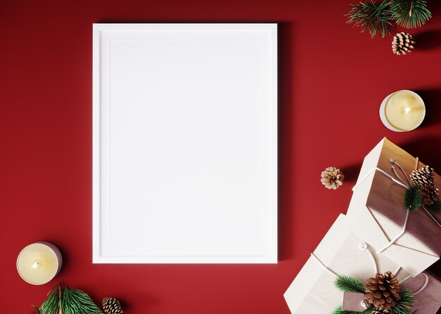 白いフレーム、装飾されたクリスマスツリー、キャンドル、赤い背景のギフト装飾でモックアップの垂直ポスター。