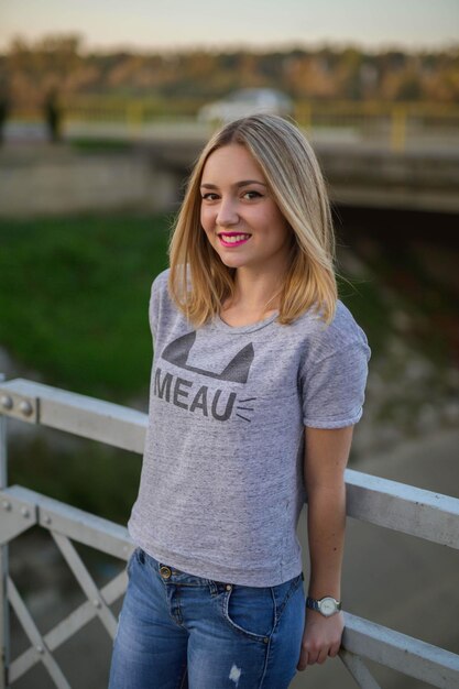 Vertical shot of a beautiful caucasian woman posing outdoors in a park in Bosnia and Herzegovina