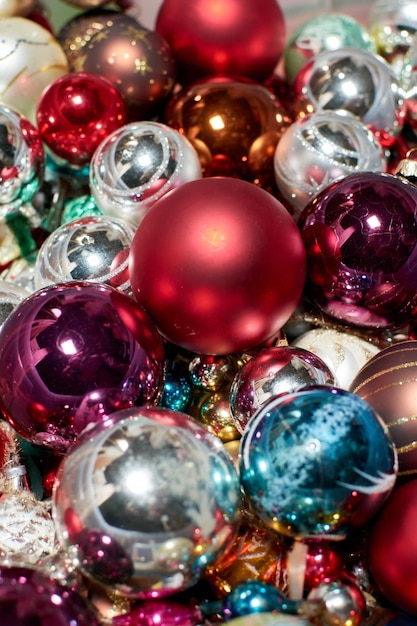 A vertical shot of colorful Christmas tree balls