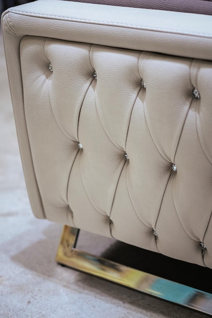 vertical shot of cream and gray shaded leather sofa