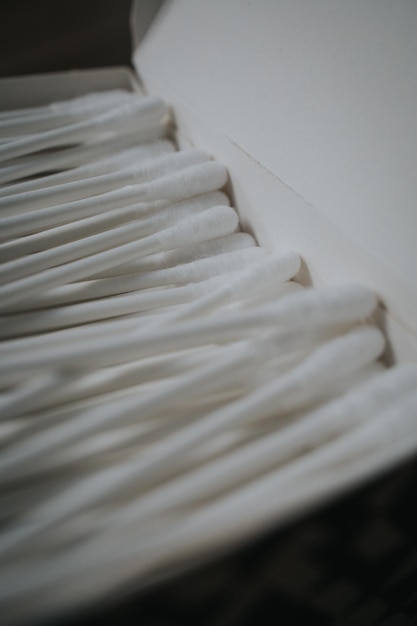 Vertical shot of ear sticks on the white box