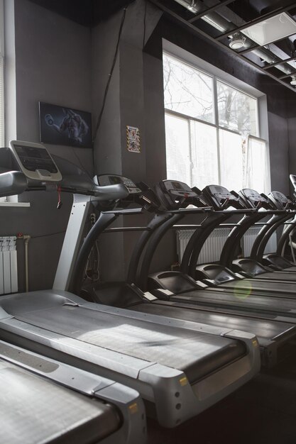 Vertical shot of empty treadmills at sports studio