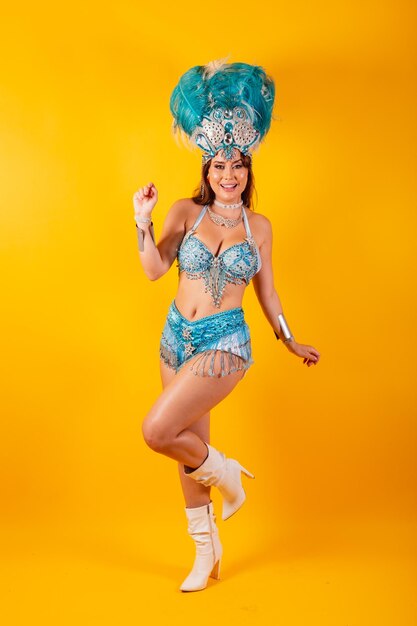 Vertical shot full body beautiful brazilian woman in carnival clothes posing for photo