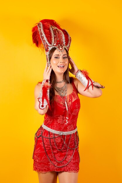 Vertical shot half body beautiful brazilian woman in carnival clothes posing for photo