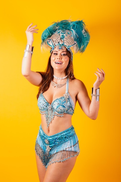 Vertical shot half body beautiful brazilian woman in carnival clothes posing for photo