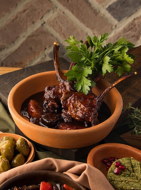 Vertical shot of a tomahawk steak and appetizers