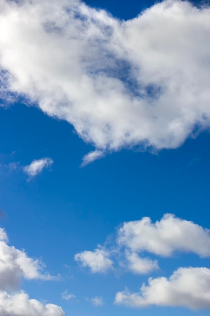 Vertical sky background with white clouds