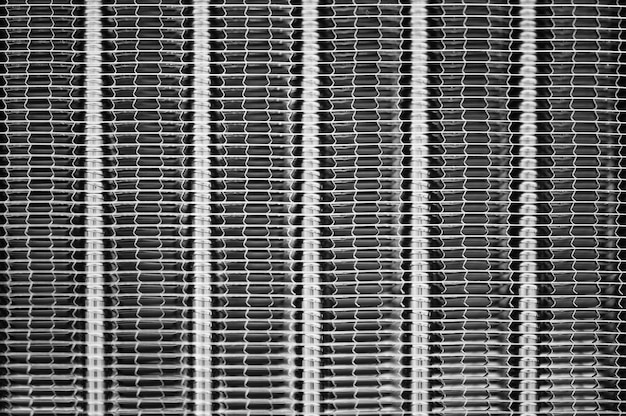 Vertical stripes of a textured metal surface.