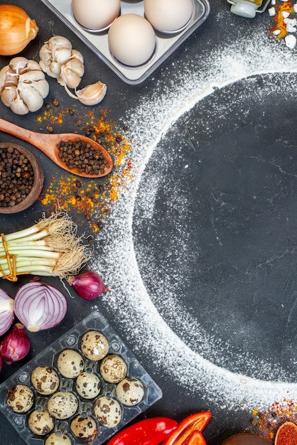 Vertical view of fresh various foods set with flour around