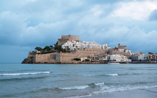 Vertical view of Peniscola castle on a cloudy day