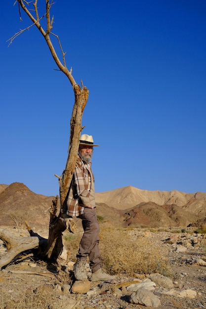 Vertical view of senior man in the desert