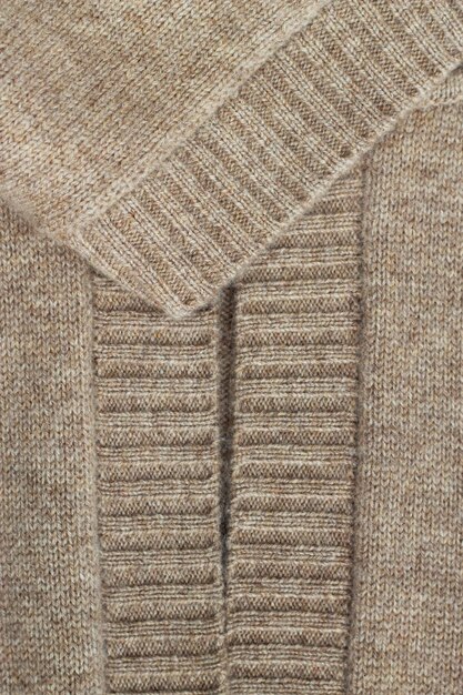 vertical warm beige background with texture of the cashmere knitted clothes