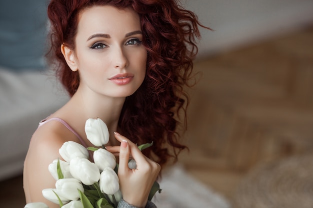 Very attractive young woman close up portrait. Beautiful female indoor.  