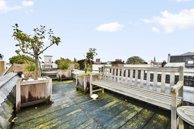 A very beautiful place with greenery on the roof with wooden benches