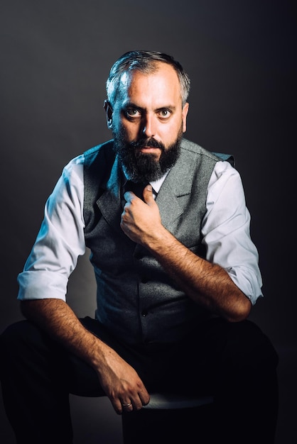 Very charismatic looking bearded man portrait in studio