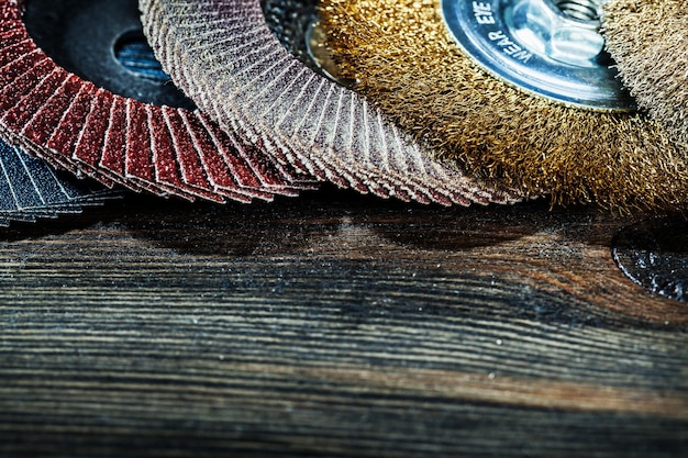 Very close up view abrasive tools discs on vintage wood