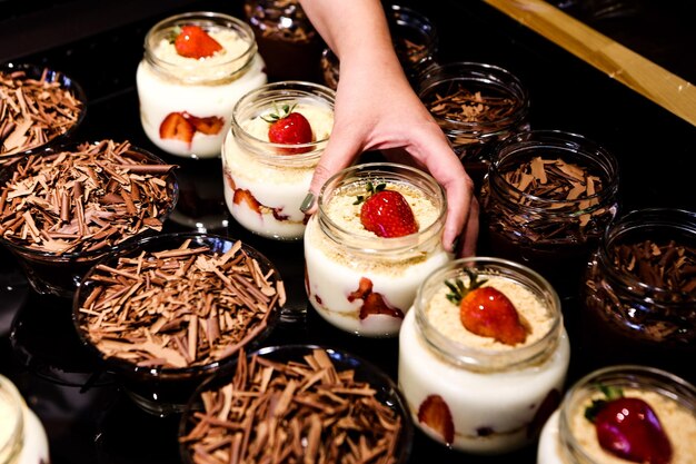 Very delicious dessert in jars sweet and cakes in jars