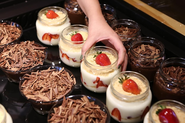 Very delicious dessert in jars sweet and cakes in jars