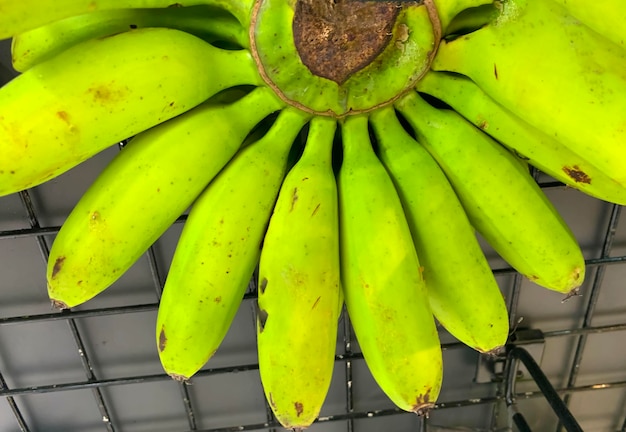 Very fresh and ripe delicious banana cluster or banana hand or a bunch of bananas fruit healthy diet supermarket product