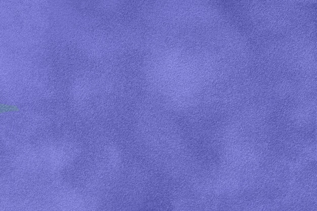 Very peri matte background of suede fabric macro Velvet texture of seamless navy blue leather